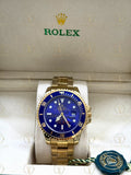 SUBMARINER gold , blue dial, oyster bracelet